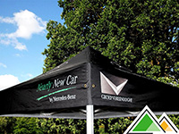 Full colour bedrukt dakzeil reclame tent voor Garage Vereenooghe. Personalisatie van top, pitch en volants.